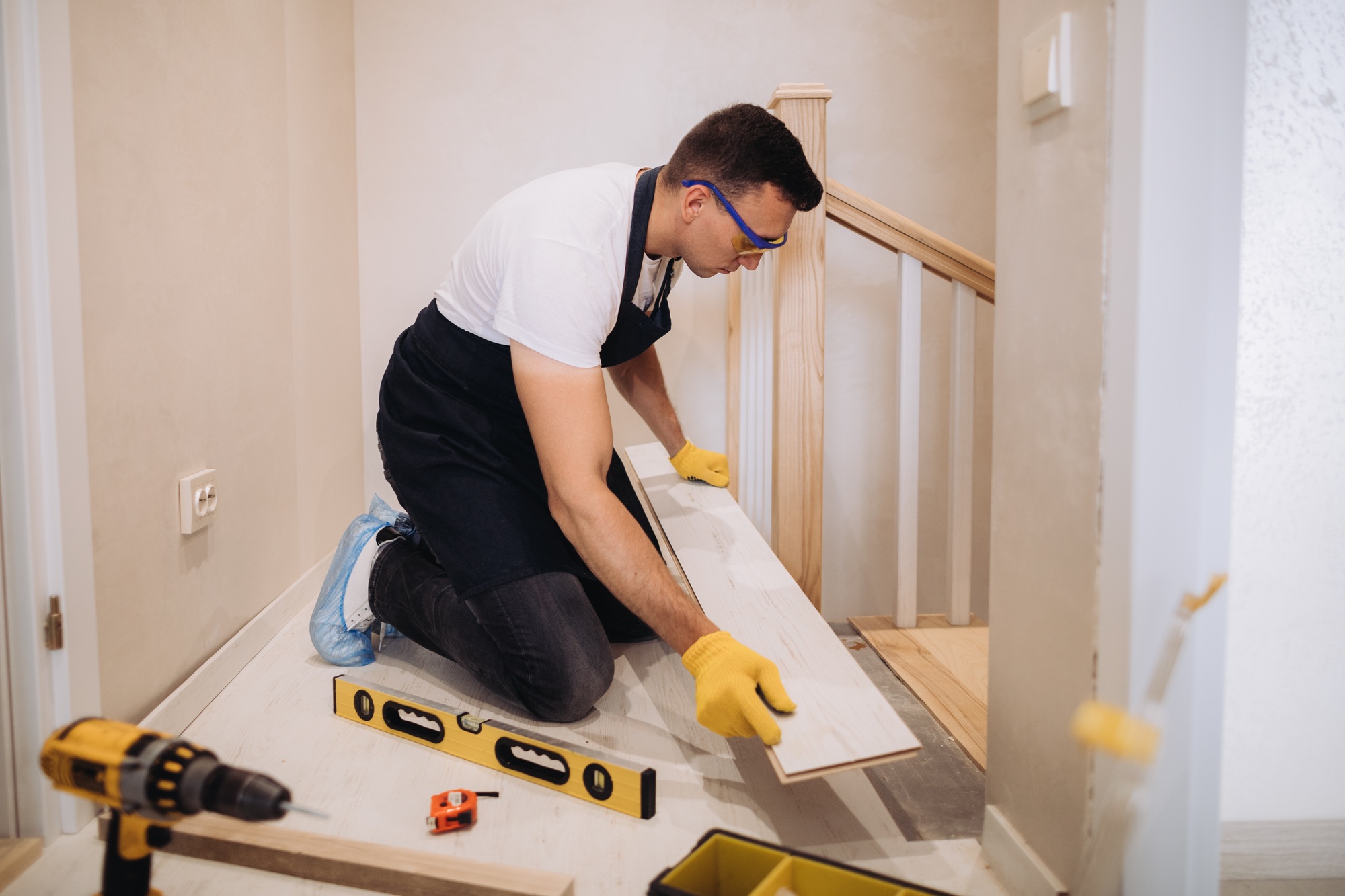 Maintenance man fixing a new floor